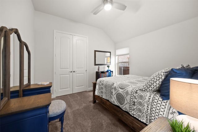 bedroom featuring lofted ceiling, a closet, dark carpet, and ceiling fan