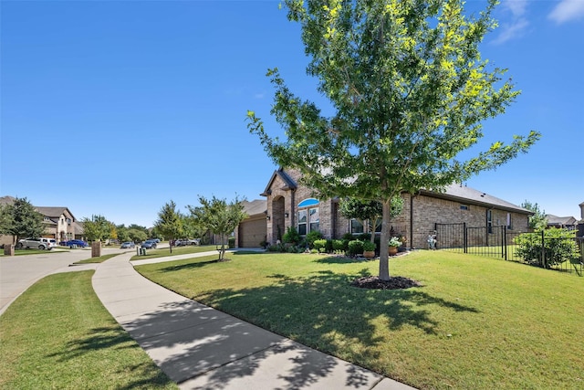 exterior space with brick siding, fence, and a front lawn