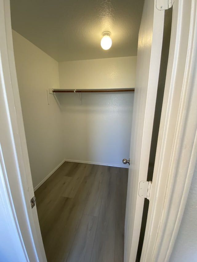 spacious closet with wood finished floors