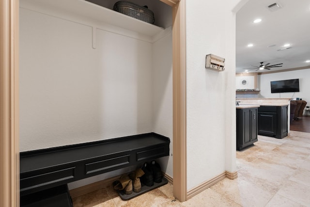 interior space featuring ceiling fan, recessed lighting, visible vents, and baseboards