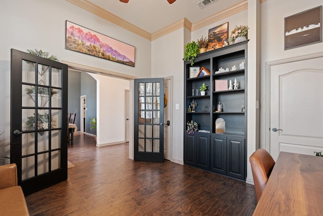 home office featuring ceiling fan, visible vents, french doors, dark wood finished floors, and crown molding