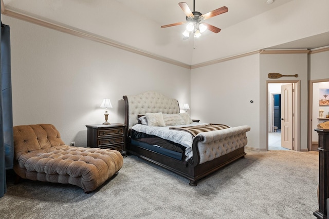 carpeted bedroom featuring ornamental molding and a ceiling fan