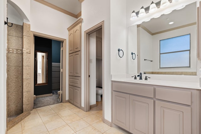 full bathroom with tile patterned flooring, vanity, toilet, and crown molding