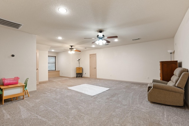 sitting room with visible vents, carpet flooring, and recessed lighting