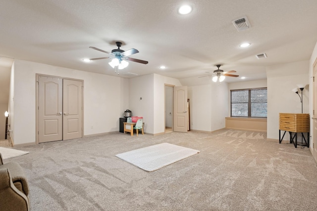 interior space featuring recessed lighting, light carpet, and baseboards