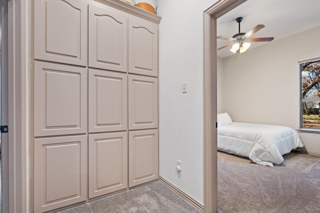 bedroom featuring carpet and baseboards