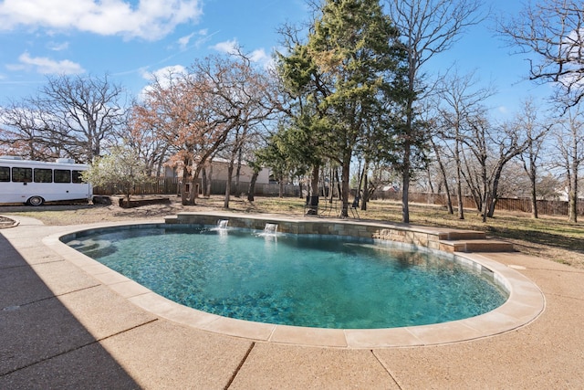 view of swimming pool with a fenced in pool and fence