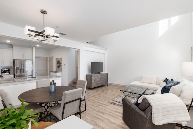 dining room with recessed lighting, visible vents, and light wood-style floors