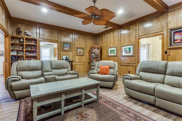 living room featuring ceiling fan, beam ceiling, light wood-type flooring, and visible vents