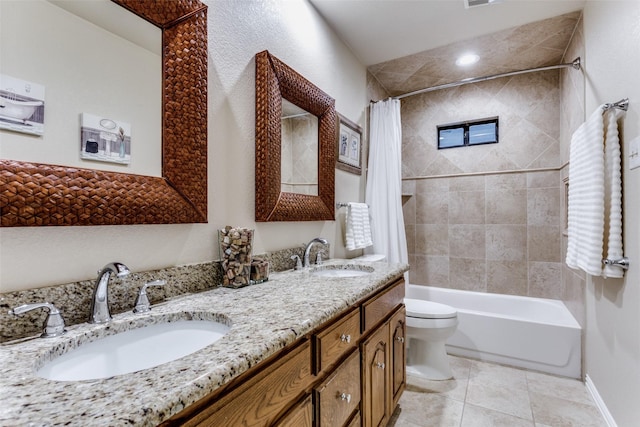 full bath with toilet, shower / bath combination with curtain, a sink, and tile patterned floors