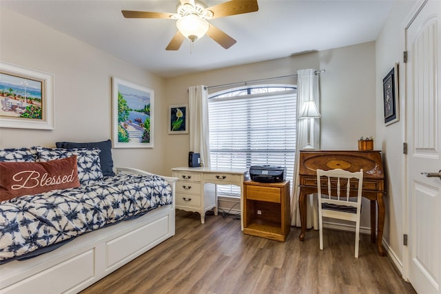 bedroom featuring ceiling fan and wood finished floors