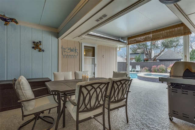 view of patio featuring visible vents, a grill, fence, outdoor dining area, and a pool with connected hot tub