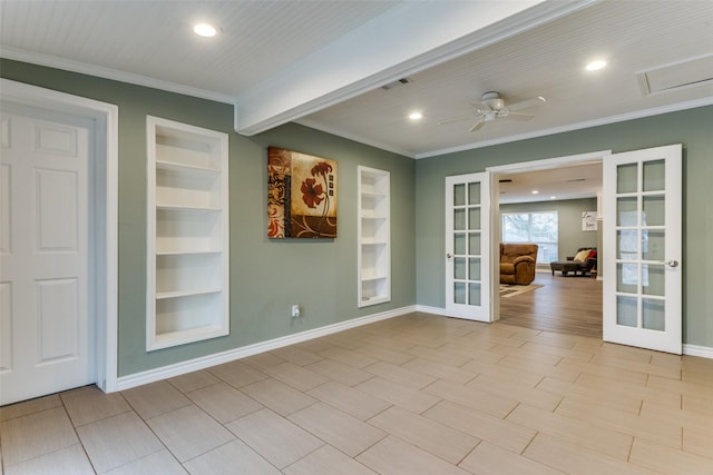 empty room with ornamental molding, french doors, and built in shelves