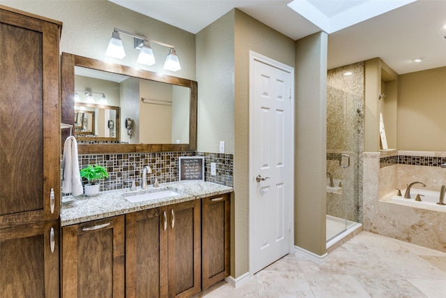 full bathroom with a garden tub, a stall shower, backsplash, and vanity