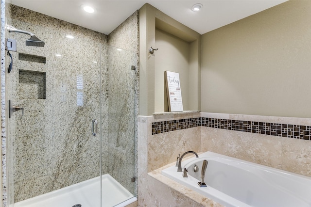 full bath with a garden tub, a shower stall, and recessed lighting