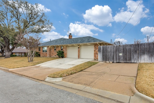 view of front of home with brick siding, fence, a chimney, and an attached garage