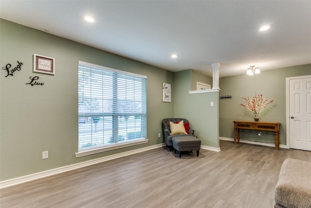 living area with recessed lighting, light wood-style flooring, and baseboards