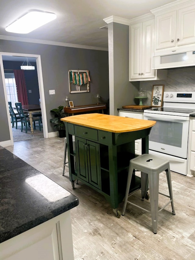 kitchen with exhaust hood, white cabinetry, green cabinets, ornamental molding, and white range with electric stovetop