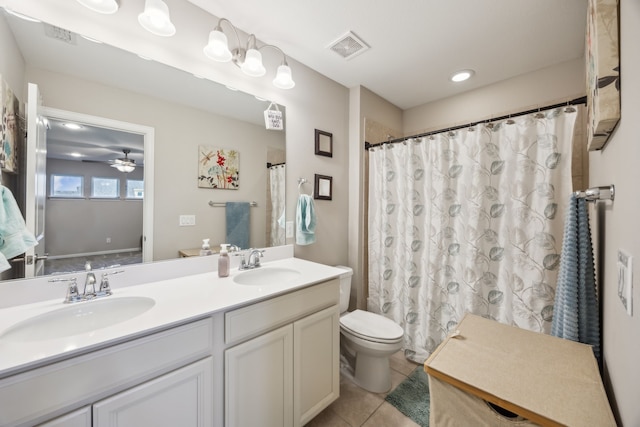 full bath with double vanity, a sink, visible vents, and tile patterned floors