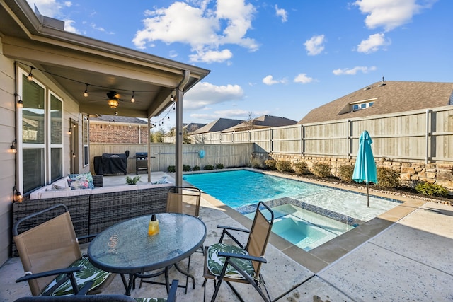 view of pool featuring a fenced backyard, a ceiling fan, a fenced in pool, and an in ground hot tub