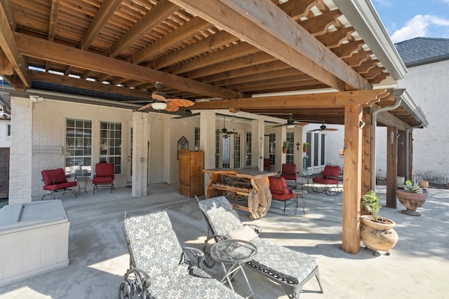 view of patio / terrace with outdoor dining area and a ceiling fan