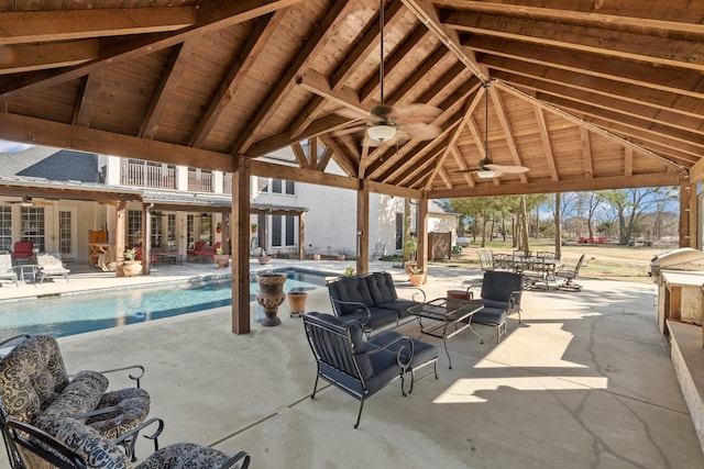 view of patio with outdoor lounge area, an outdoor pool, a ceiling fan, and a gazebo