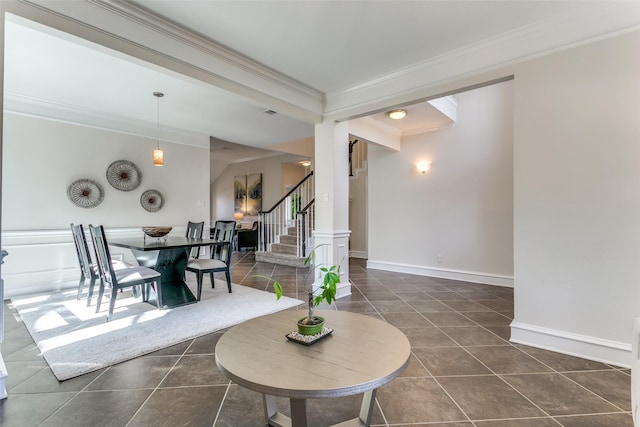 interior space with crown molding, dark tile patterned flooring, stairway, and baseboards