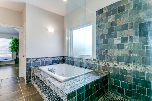 bathroom featuring tile patterned floors and a whirlpool tub