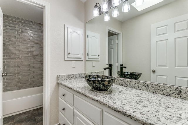 bathroom featuring vanity and shower / bath combination