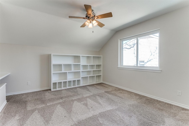 additional living space featuring baseboards, carpet floors, ceiling fan, and vaulted ceiling