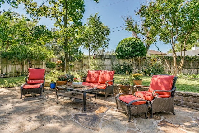 view of patio / terrace featuring an outdoor living space and a fenced backyard