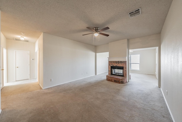 12104 Rolling Ridge Dr, Fort Worth, TX 76028 - unfurnished living room featuring a ceiling fan, light carpet, baseboards, a brick fireplace, and a textured ceiling