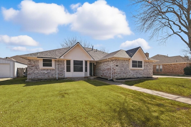 ranch-style house with brick siding, a chimney, and a front lawn