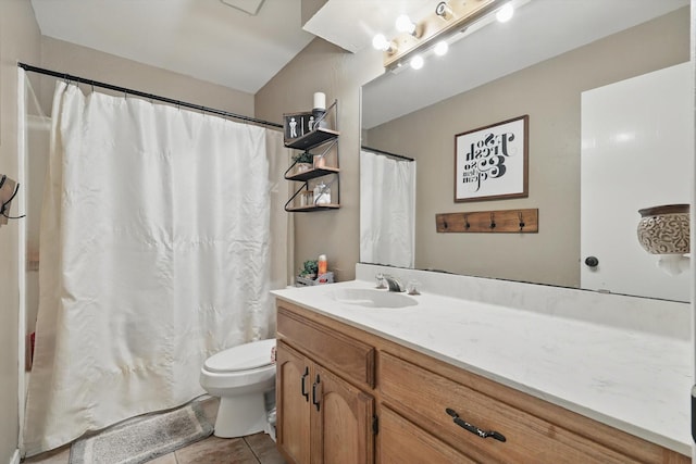 bathroom featuring toilet, tile patterned flooring, and vanity