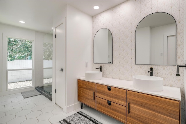 full bath featuring tile patterned flooring, a sink, recessed lighting, and double vanity