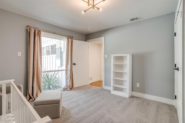 unfurnished bedroom with baseboards, visible vents, and light colored carpet