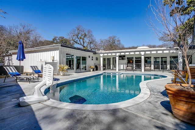 view of pool with a patio area, fence, and a fenced in pool