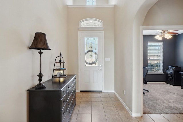 2408 Alta Vista Dr, Denton, TX 76210 - entrance foyer featuring light tile patterned floors, arched walkways, and ceiling fan
