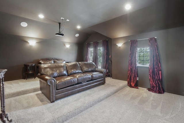 carpeted home theater room featuring recessed lighting and lofted ceiling