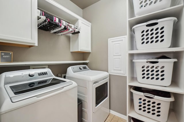 laundry room featuring light tile patterned flooring, cabinet space, and independent washer and dryer