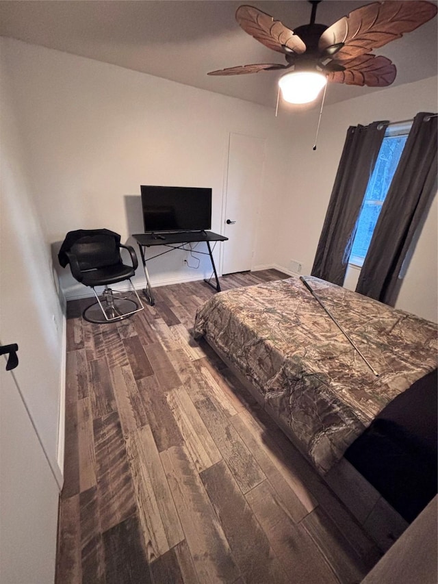 bedroom featuring ceiling fan and wood finished floors