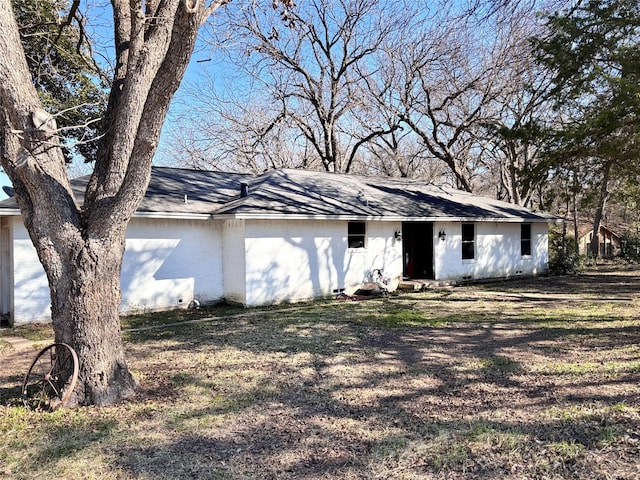 view of front of house featuring roof with shingles