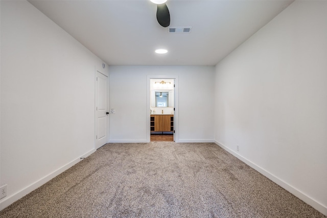 unfurnished room with baseboards, visible vents, ceiling fan, and carpet flooring