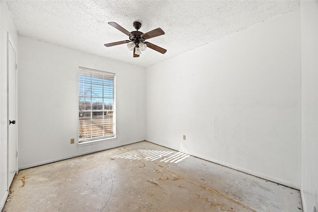 spare room with ceiling fan and a textured ceiling