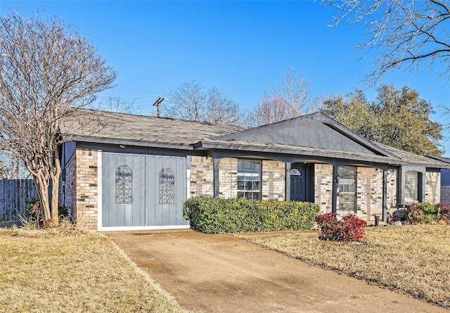 single story home featuring brick siding and fence