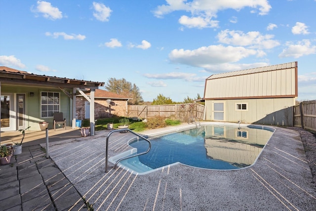 view of pool with a fenced in pool, a wooden deck, and a fenced backyard