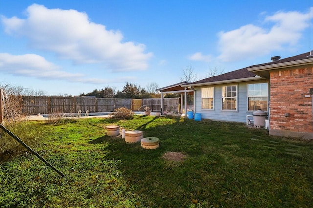view of yard with a fenced backyard
