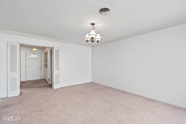 carpeted empty room featuring visible vents, crown molding, baseboards, and an inviting chandelier