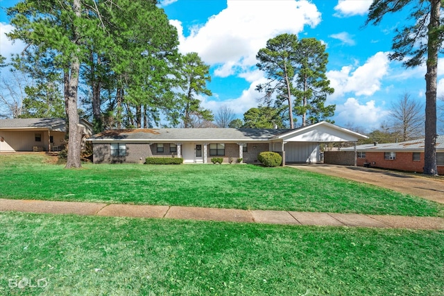 ranch-style house with driveway, an attached carport, a front yard, and brick siding