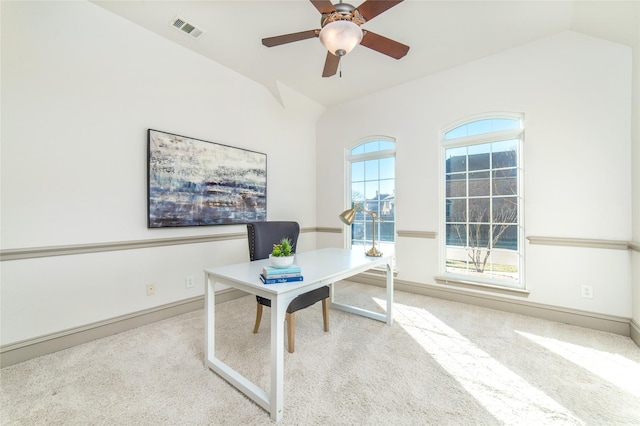 office with light colored carpet, visible vents, and lofted ceiling